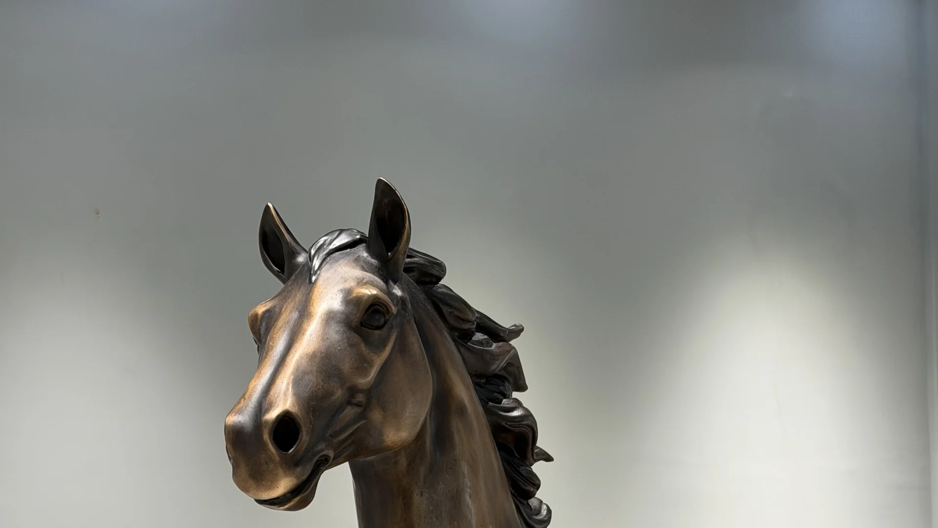 Finished bronze horse sculpture photographed in the Zuvonart showroom