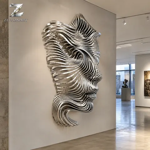 Concentric rippling bands create a shell-like reflective wall relief.