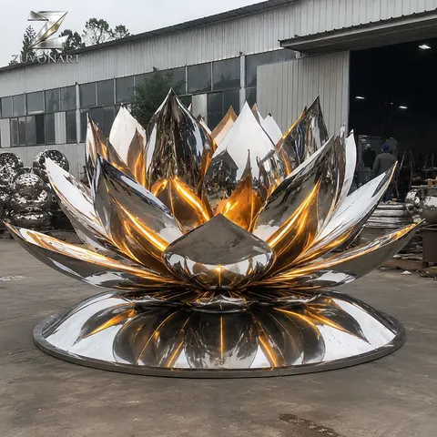 Reflective lotus-like petals open around a warm illuminated center.
