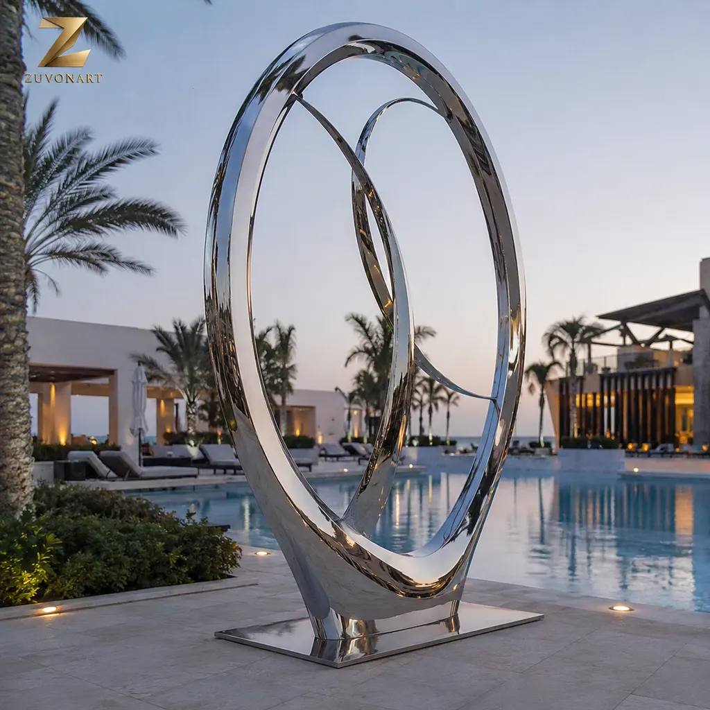 Two tall reflective oval loops overlap to create an open architectural silhouette.