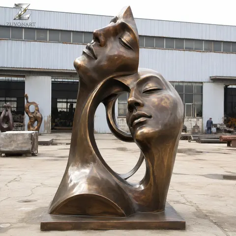 Two face-like forms meet in a compact dual-portrait composition.