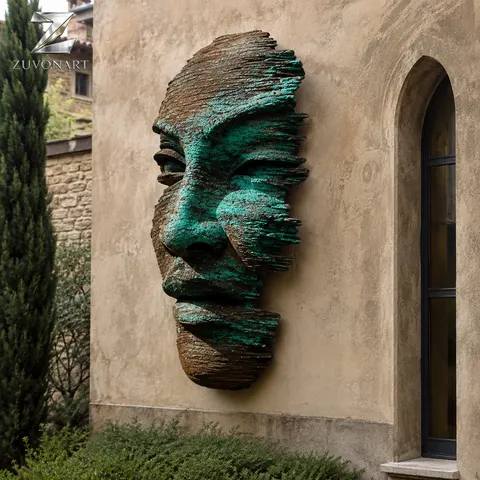 Layered contour-like bands form a face in a green patina color direction.