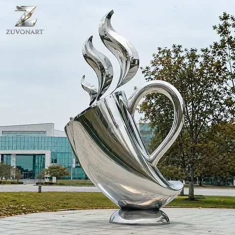 An oversized reflective cup is topped by an upward-curving steam-like element.