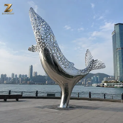 A whale rises in an arcing pose with a perforated, openwork body.