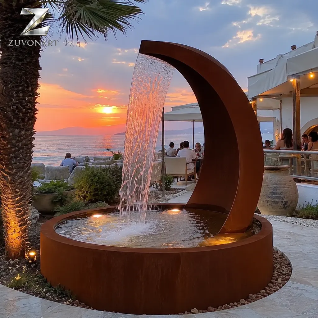 A crescent-like upright form frames a sheet of water above a receiving basin.