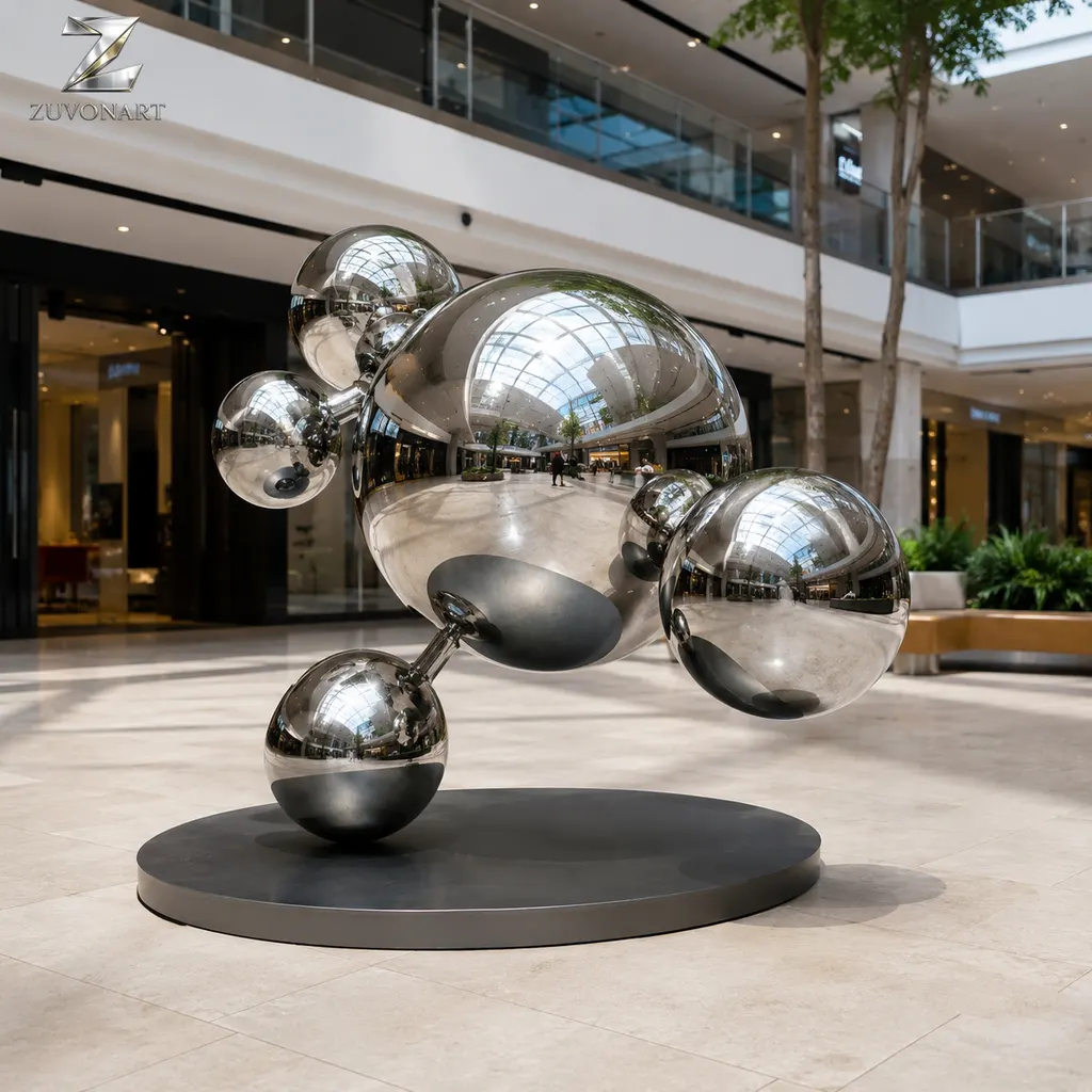 Reflective spheres appear stacked in a vertically offset balancing composition.