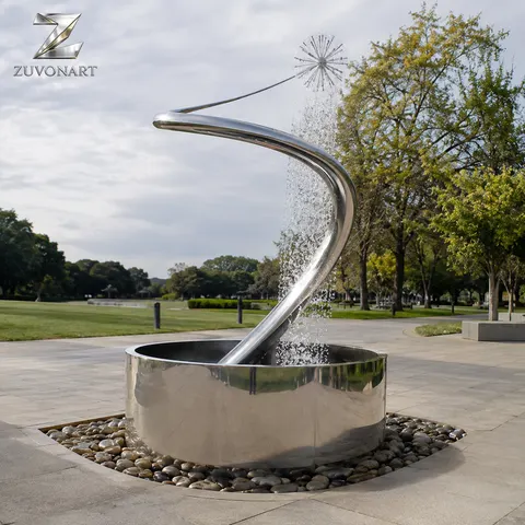 A slender elevated arc directs water toward a low receiving basin.