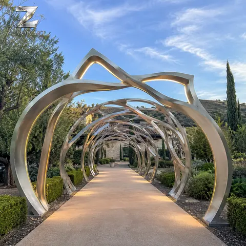 Repeated twisting arches suggest a walk-through sculptural garden sequence.