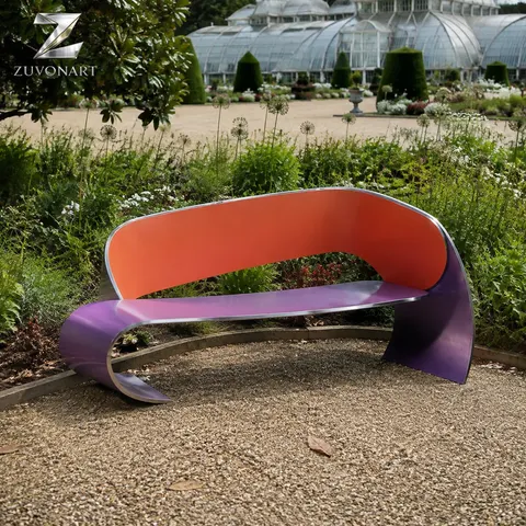 Orange and purple curved surfaces sweep into a continuous low bench-like form.